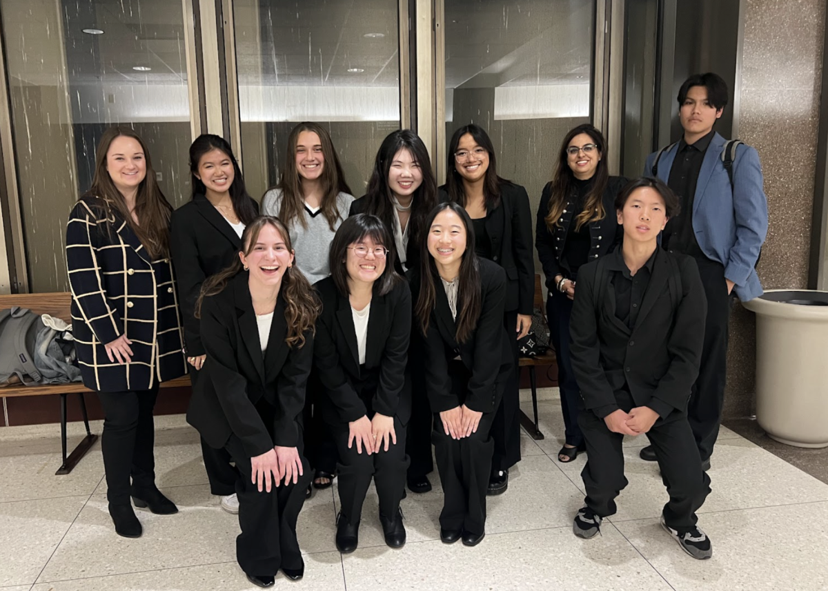 Members of the Mock Trial club gather to celebrate after their inaugural tournament season on Tuesday, Nov. 19, inside the Superior Court of California, County of Orange.